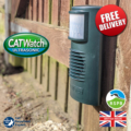 The CATWatch Ultrasonic cat deterrent hung from a garden fence, about 8 - 10 inches from the ground